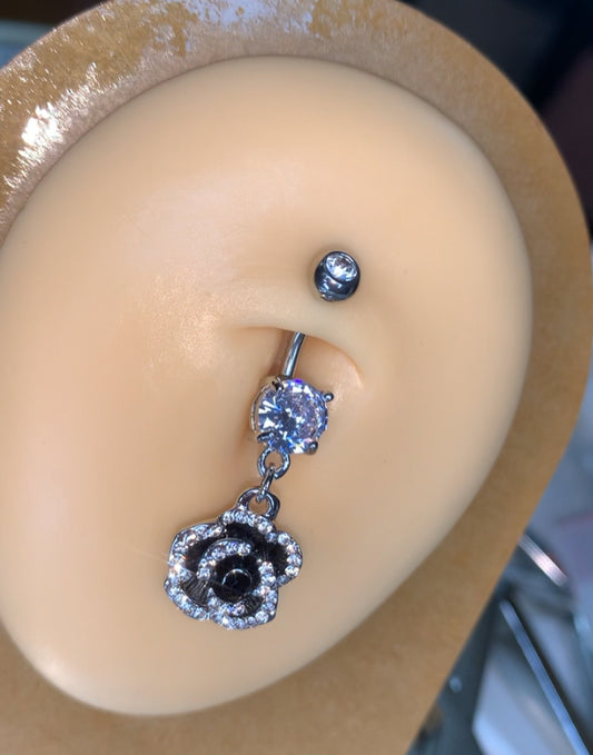 Black studded flower belly ring